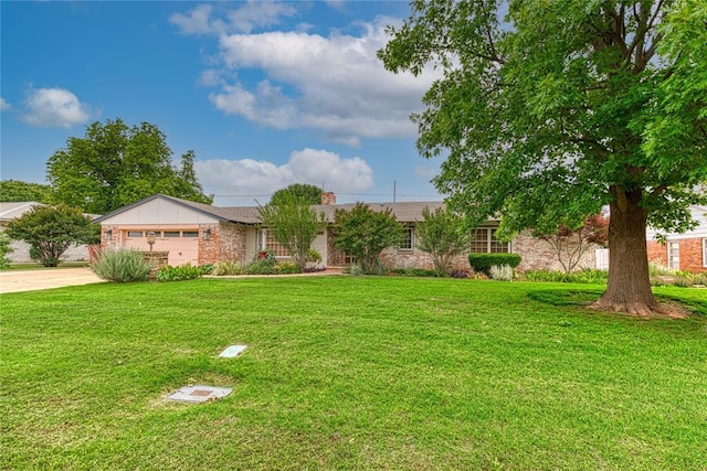 1301 W C Ave, Elk City, OK 73644 - ranch-style house with driveway, a front lawn, an attached garage, a chimney, and stone siding