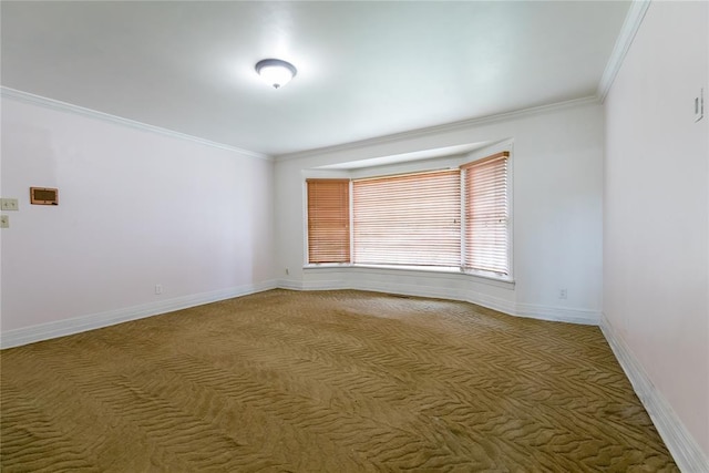 1301 W C Ave, Elk City, OK 73644 - empty room featuring crown molding, light carpet, and baseboards