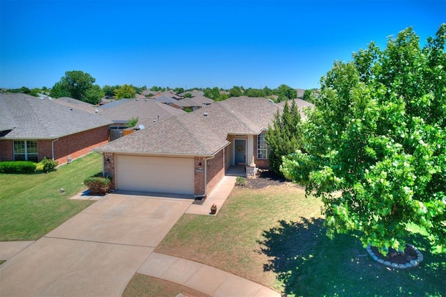 16020 Panther Way, Edmond, OK 73013 - view of front of house featuring brick siding, a garage, concrete driveway, a front lawn, and roof with shingles