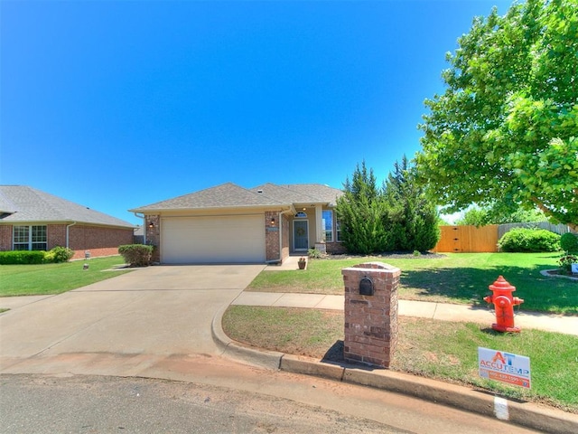 16020 Panther Way, Edmond, OK 73013 - ranch-style house featuring an attached garage, driveway, and brick siding