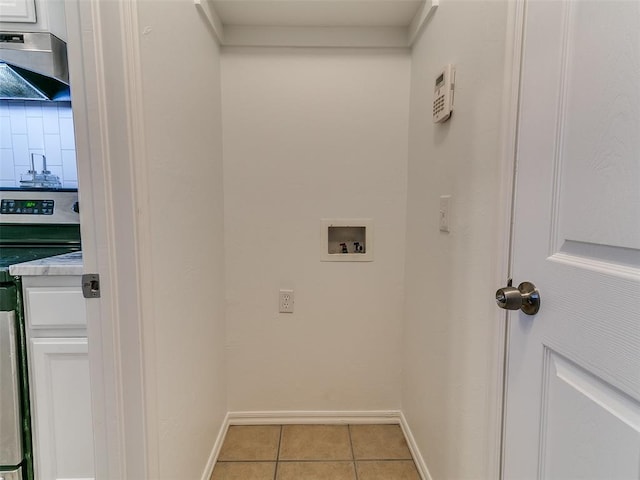 16020 Panther Way, Edmond, OK 73013 - laundry area with light tile patterned flooring, washer hookup, and baseboards