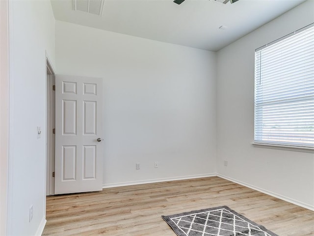 16020 Panther Way, Edmond, OK 73013 - unfurnished room with wood finished floors and baseboards
