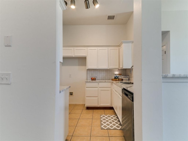 16020 Panther Way, Edmond, OK 73013 - kitchen featuring dishwasher, tasteful backsplash, white cabinetry, light tile patterned flooring, and a sink