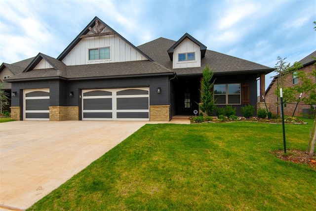 14601 Chambord Dr, Yukon, OK 73099 - craftsman inspired home featuring driveway, a front yard, a garage, board and batten siding, and a shingled roof