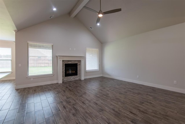 14601 Chambord Dr, Yukon, OK 73099 - unfurnished living room featuring ceiling fan, beam ceiling, a fireplace, dark wood-type flooring, and baseboards