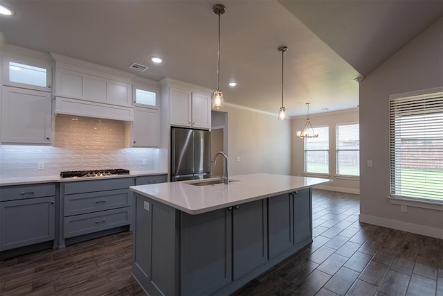 14601 Chambord Dr, Yukon, OK 73099 - kitchen with appliances with stainless steel finishes, gray cabinets, a sink, tasteful backsplash, and light countertops