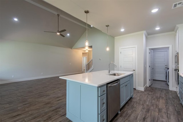 14601 Chambord Dr, Yukon, OK 73099 - kitchen featuring appliances with stainless steel finishes, a sink, dark wood-type flooring, a center island with sink, and light countertops