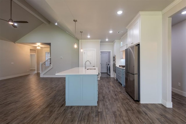14601 Chambord Dr, Yukon, OK 73099 - kitchen featuring stainless steel appliances, a ceiling fan, white cabinetry, baseboards, and an island with sink