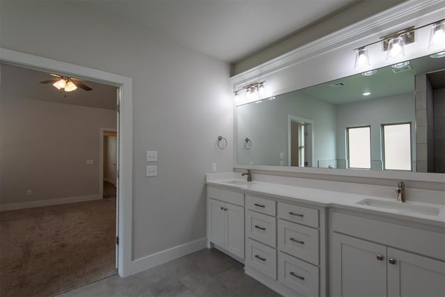 14601 Chambord Dr, Yukon, OK 73099 - bathroom with double vanity, a ceiling fan, and baseboards