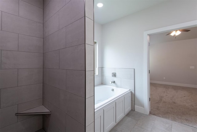 14601 Chambord Dr, Yukon, OK 73099 - full bathroom featuring a bath, a ceiling fan, baseboards, and tile patterned floors