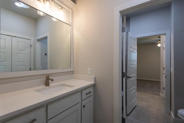 14601 Chambord Dr, Yukon, OK 73099 - bathroom with vanity, a ceiling fan, and toilet