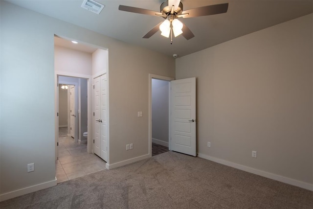 14601 Chambord Dr, Yukon, OK 73099 - unfurnished bedroom featuring carpet floors, baseboards, and ceiling fan