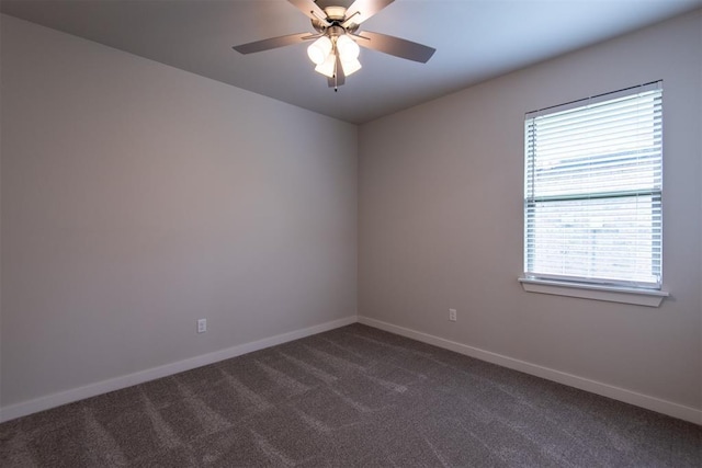 14601 Chambord Dr, Yukon, OK 73099 - empty room featuring dark colored carpet, baseboards, and ceiling fan