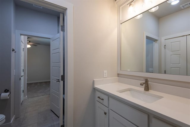 14601 Chambord Dr, Yukon, OK 73099 - bathroom featuring vanity, a ceiling fan, and toilet
