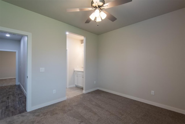 14601 Chambord Dr, Yukon, OK 73099 - unfurnished bedroom with light carpet, baseboards, connected bathroom, and ceiling fan