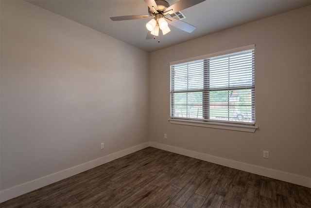 14601 Chambord Dr, Yukon, OK 73099 - unfurnished room with baseboards, dark wood-style floors, and a ceiling fan