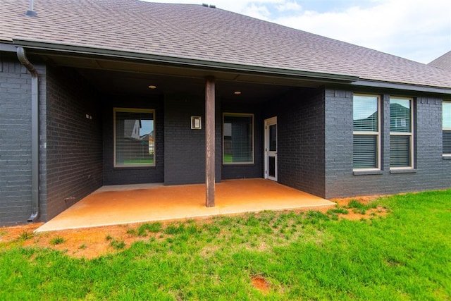 14601 Chambord Dr, Yukon, OK 73099 - view of exterior entry featuring brick siding