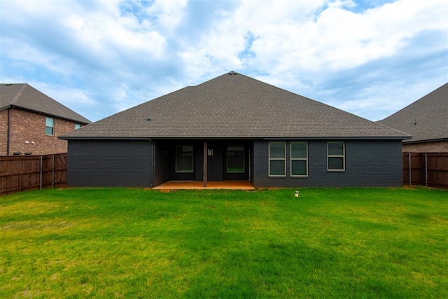 14601 Chambord Dr, Yukon, OK 73099 - back of house with a patio area, roof with shingles, and brick siding