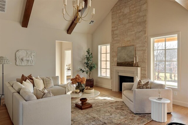 3817 Shady Hill Trl, Edmond, OK 73034 - living area featuring a chandelier, high vaulted ceiling, wood finished floors, baseboards, and beamed ceiling
