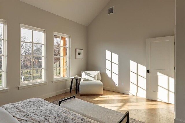 3817 Shady Hill Trl, Edmond, OK 73034 - bedroom featuring wood finished floors, high vaulted ceiling, and baseboards