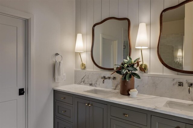 3817 Shady Hill Trl, Edmond, OK 73034 - bathroom featuring decorative backsplash and double vanity