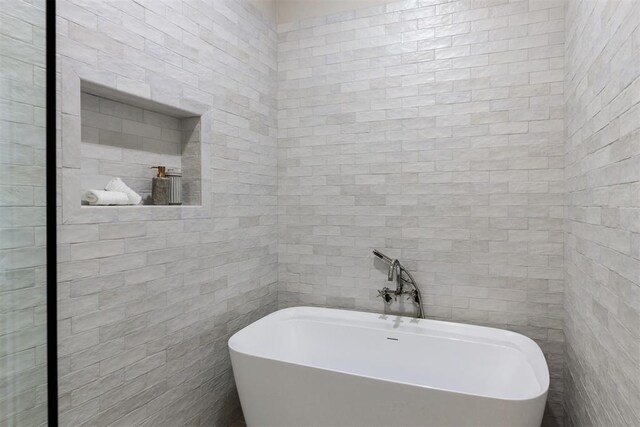 3817 Shady Hill Trl, Edmond, OK 73034 - full bath featuring tile walls and a freestanding tub