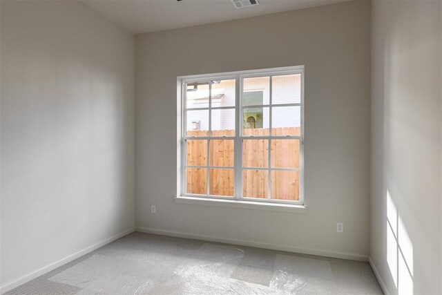 3817 Shady Hill Trl, Edmond, OK 73034 - empty room featuring light carpet and baseboards