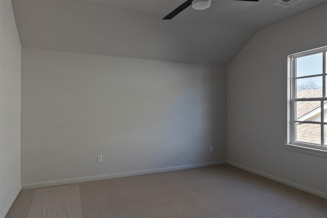 3817 Shady Hill Trl, Edmond, OK 73034 - additional living space featuring a ceiling fan, lofted ceiling, light colored carpet, and baseboards