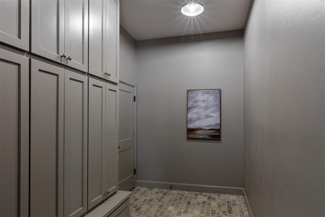 3817 Shady Hill Trl, Edmond, OK 73034 - mudroom with baseboards and light tile patterned floors
