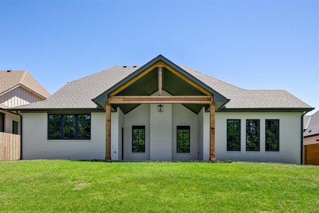 3817 Shady Hill Trl, Edmond, OK 73034 - view of front facade featuring brick siding, a front lawn, and roof with shingles