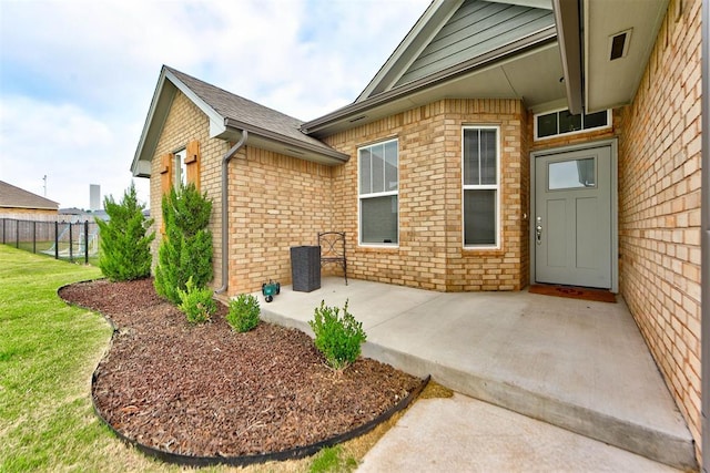 715 SE 37th St, Newcastle, OK 73065 - view of exterior entry featuring brick siding and a patio area