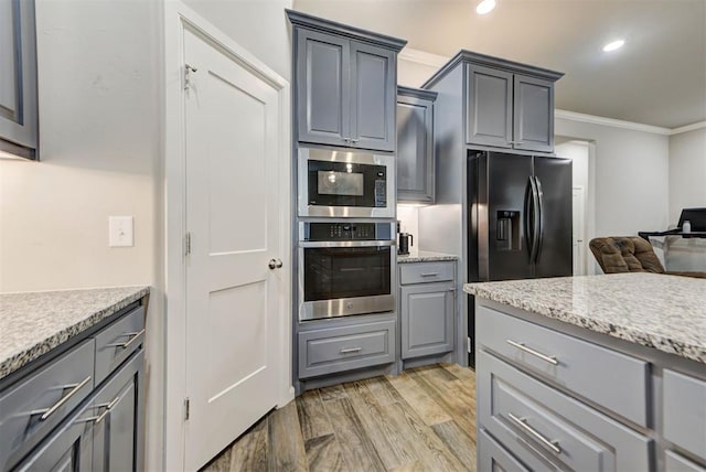 715 SE 37th St, Newcastle, OK 73065 - kitchen featuring appliances with stainless steel finishes, gray cabinetry, crown molding, light wood finished floors, and recessed lighting