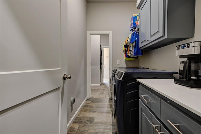 715 SE 37th St, Newcastle, OK 73065 - laundry room featuring washer and dryer, cabinet space, baseboards, and wood finished floors