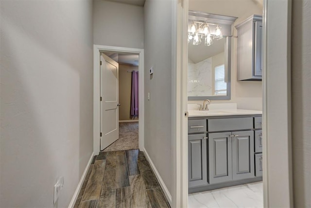 715 SE 37th St, Newcastle, OK 73065 - bathroom with a chandelier, vanity, and baseboards