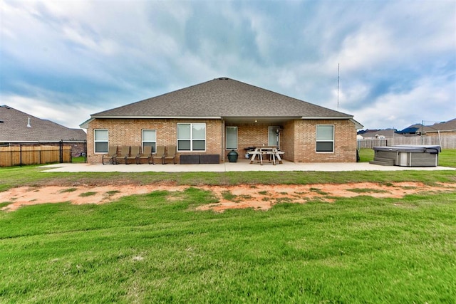 715 SE 37th St, Newcastle, OK 73065 - back of house with a hot tub, a patio, and brick siding