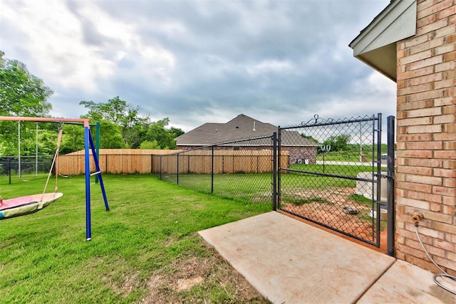 715 SE 37th St, Newcastle, OK 73065 - view of yard with a playground and a gate