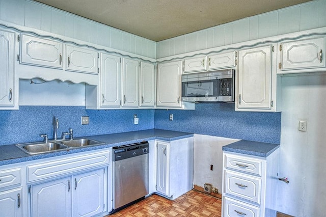 1110 Lollar Dr, Maysville, OK 73057 - kitchen featuring stainless steel appliances, a sink, and dark countertops