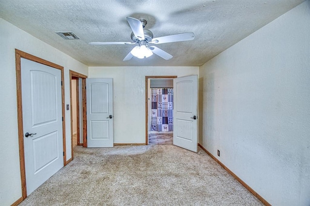 1110 Lollar Dr, Maysville, OK 73057 - unfurnished bedroom featuring carpet flooring, a textured ceiling, baseboards, a ceiling fan, and a textured wall