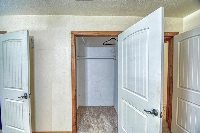 1110 Lollar Dr, Maysville, OK 73057 - unfurnished bedroom with carpet flooring, a textured wall, and a closet