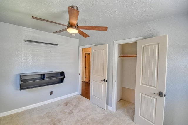 1110 Lollar Dr, Maysville, OK 73057 - unfurnished bedroom featuring carpet flooring, baseboards, a ceiling fan, and a closet