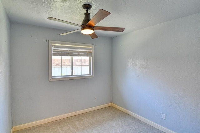 1110 Lollar Dr, Maysville, OK 73057 - carpeted spare room with baseboards, a ceiling fan, and a textured ceiling