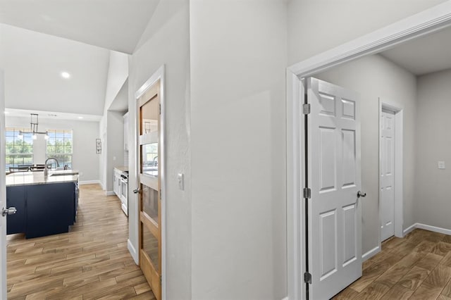 2382 County Road 1262, Blanchard, OK 73010 - hallway with light wood-style floors, baseboards, and recessed lighting