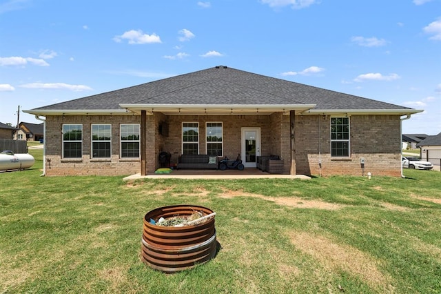 2382 County Road 1262, Blanchard, OK 73010 - rear view of house featuring brick siding, a patio, and a lawn