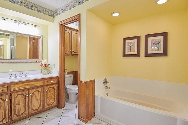 3113 Shannon Ct, Bethany, OK 73008 - bathroom with toilet, a garden tub, tile patterned floors, vanity, and recessed lighting