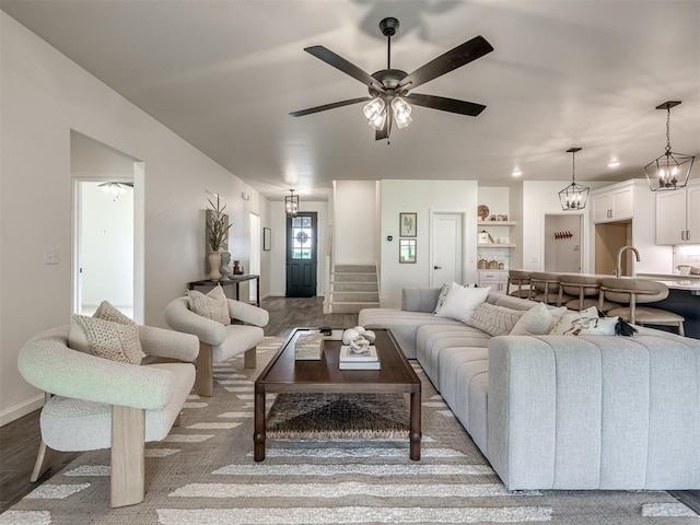 2257 Preserve Edge Dr, Edmond, OK 73034 - living room with a ceiling fan, stairs, and baseboards