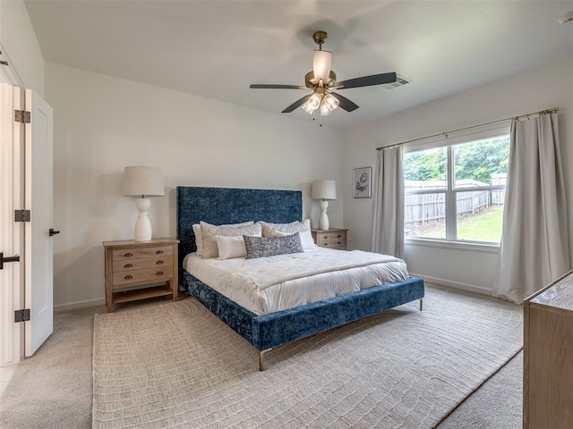2257 Preserve Edge Dr, Edmond, OK 73034 - bedroom featuring light colored carpet, baseboards, and a ceiling fan