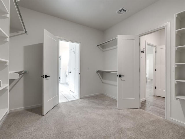 2257 Preserve Edge Dr, Edmond, OK 73034 - spacious closet featuring carpet floors