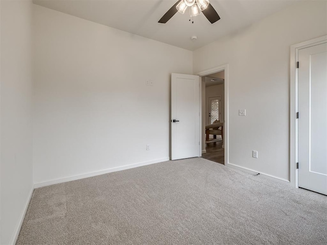 2257 Preserve Edge Dr, Edmond, OK 73034 - unfurnished bedroom featuring carpet flooring, baseboards, and ceiling fan