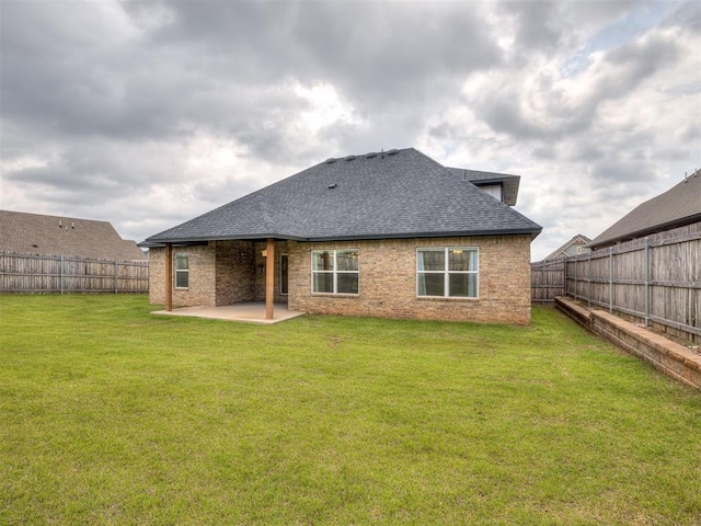 2257 Preserve Edge Dr, Edmond, OK 73034 - rear view of property featuring a shingled roof, a patio area, and brick siding