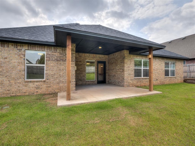 2257 Preserve Edge Dr, Edmond, OK 73034 - rear view of house with roof with shingles, a patio, and brick siding